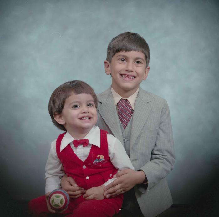 [Photo of Sukhdarshan Gill's sons]