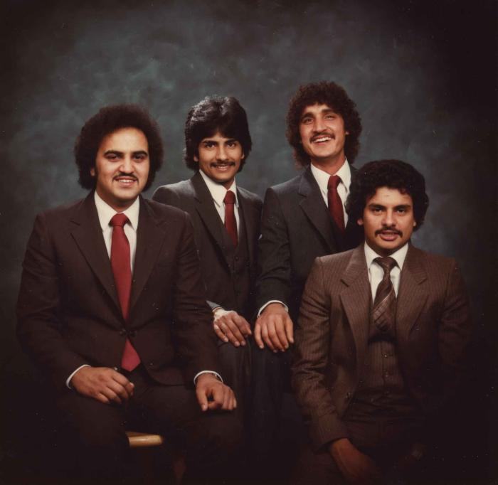 [Group photo of Gurmukh Gill with unidentified men]