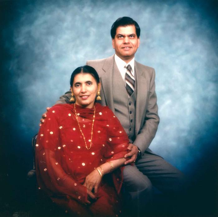 [Photo of Sukhdarshan Gill with wife]