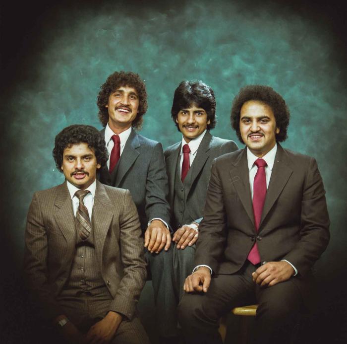 [Group photo of Gurmukh Gill with unidentified men]