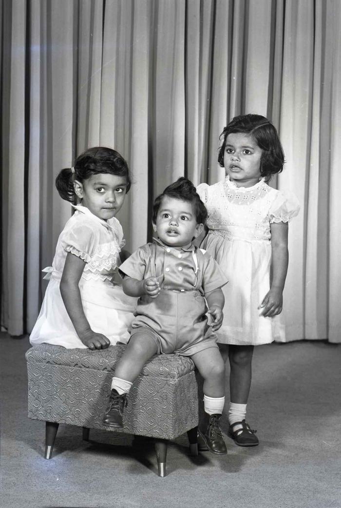 [Photo of three children]