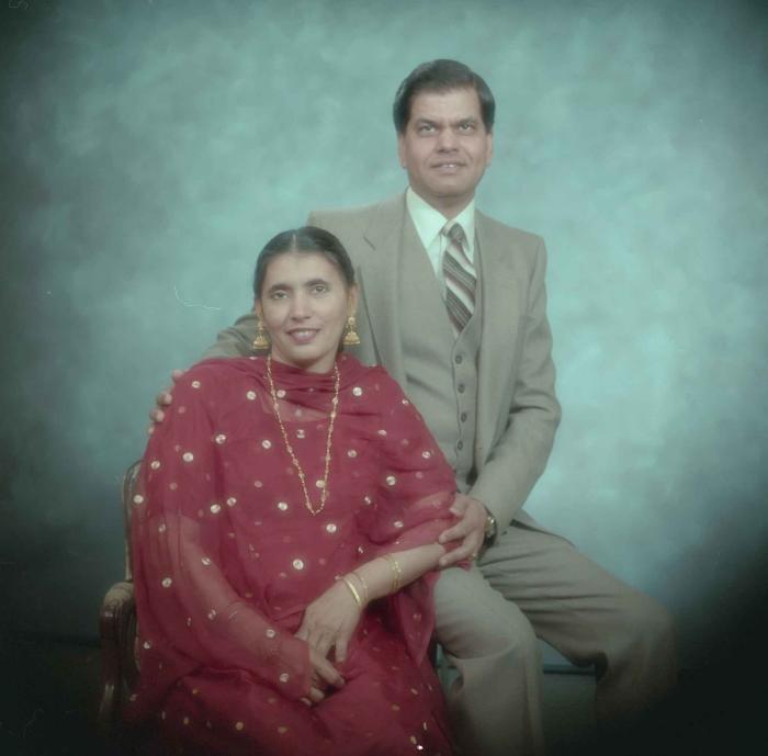 [Photo of Sukhdarshan Gill with wife]