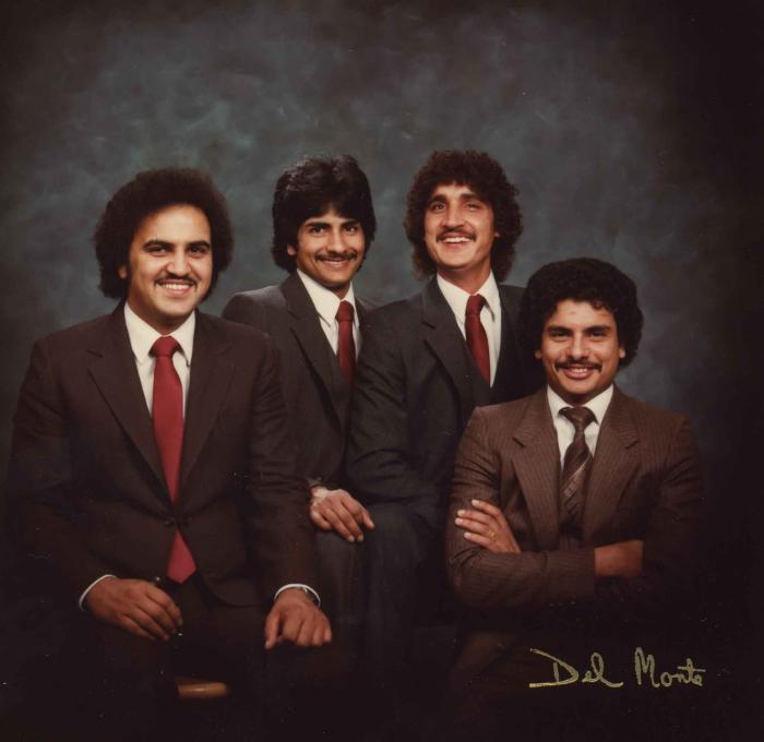 [Group photo of Gurmukh Gill with unidentified men]