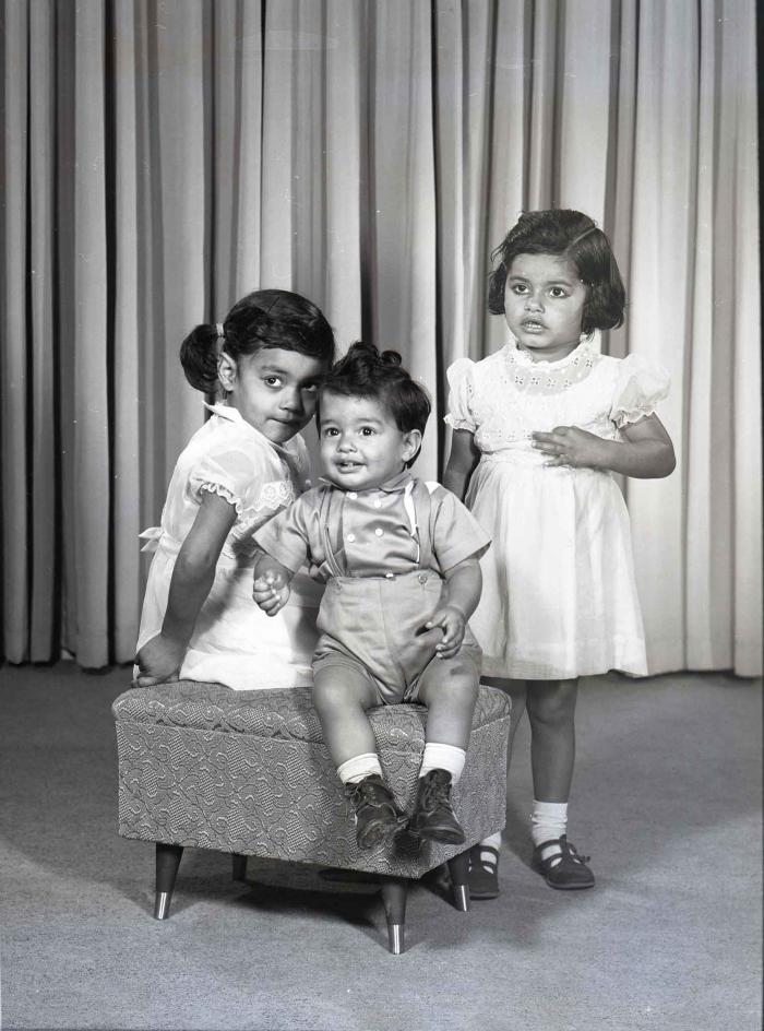 [Photo of three children]