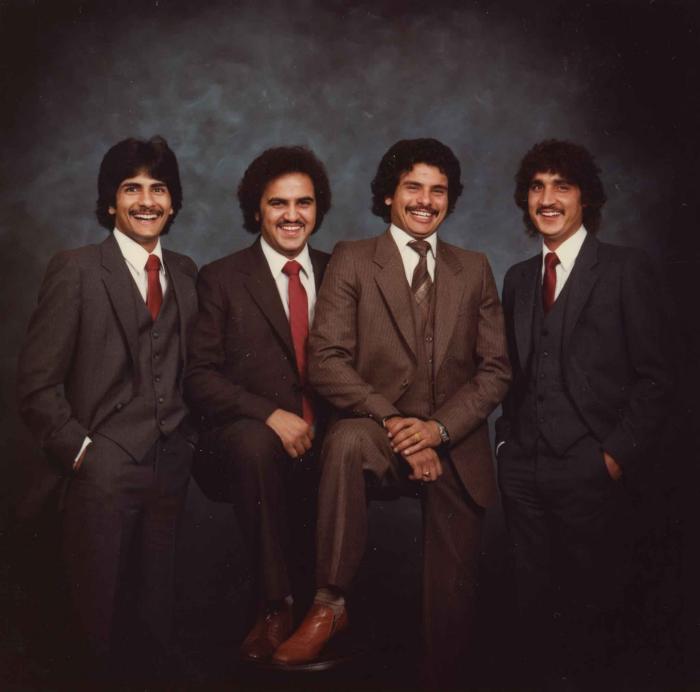 [Group photo of Gurmukh Gill with unidentified men]
