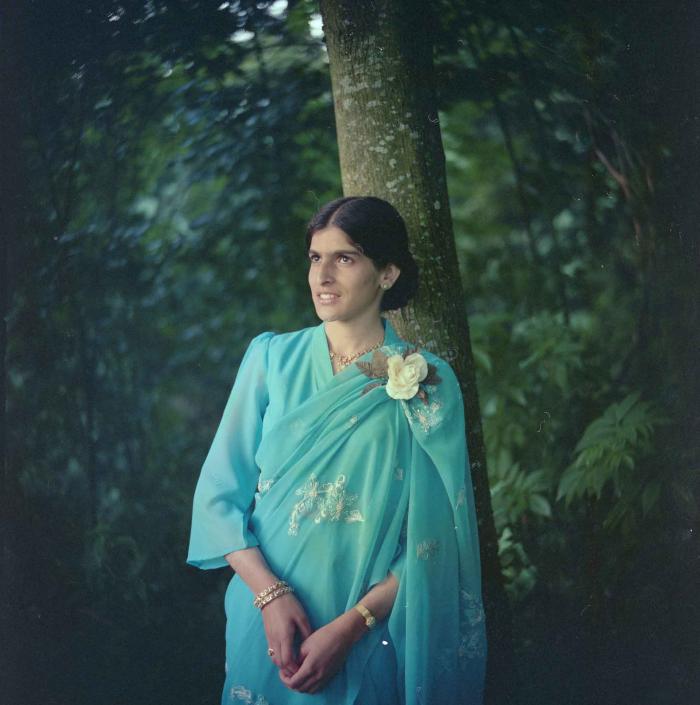 [Portrait photo of Sukhdev Gill near a tree]