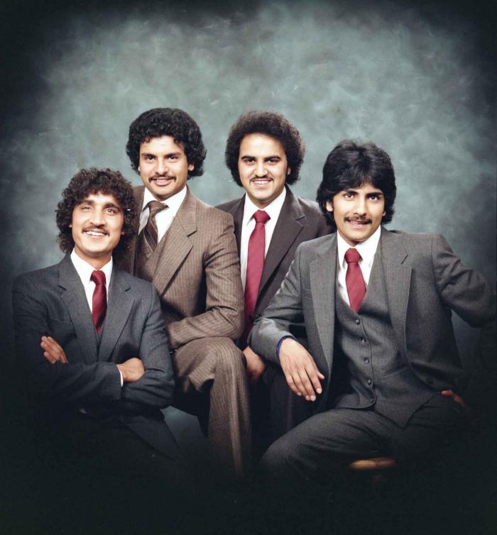 [Group photo of Gurmukh Gill with unidentified men]