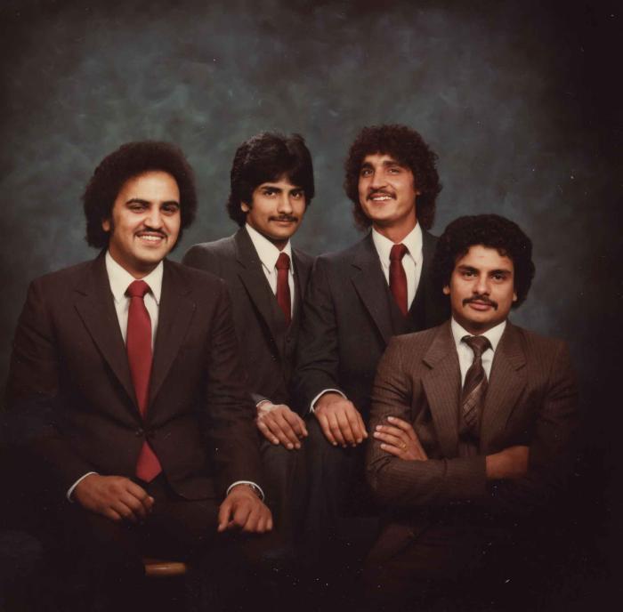 [Group photo of Gurmukh Gill with unidentified men]