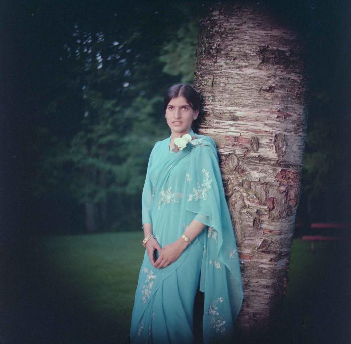 [Portrait photo of Sukhdev Gill near a tree]