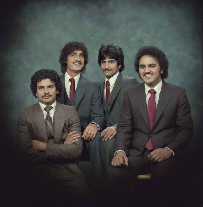 [Group photo of Gurmukh Gill with unidentified men]