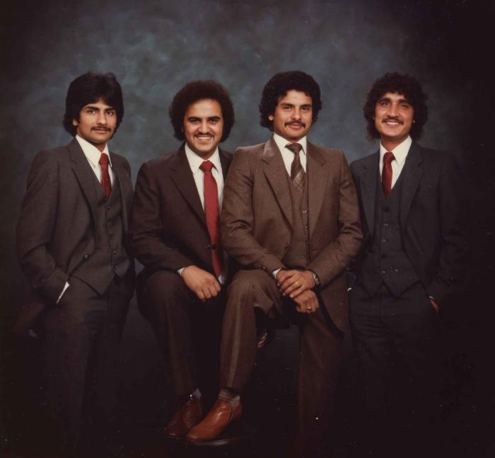 [Group photo of Gurmukh Gill with unidentified men]