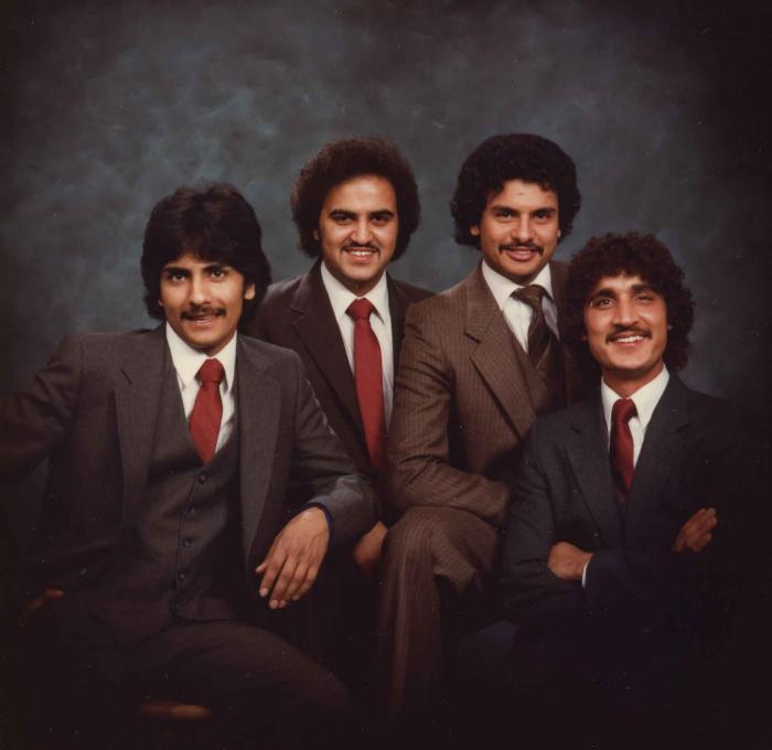 [Group photo of Gurmukh Gill with unidentified men]