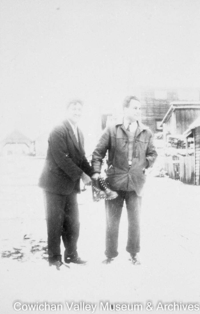 [Kishen Singh Parhar and unidentified man standing in the snow]