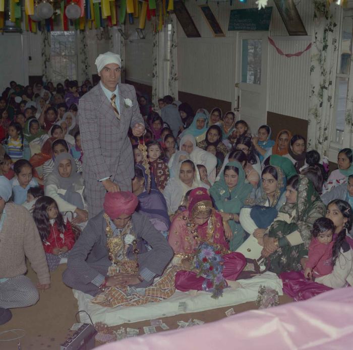 [Group photo of S. S. Gill and R. Gelna with family members]