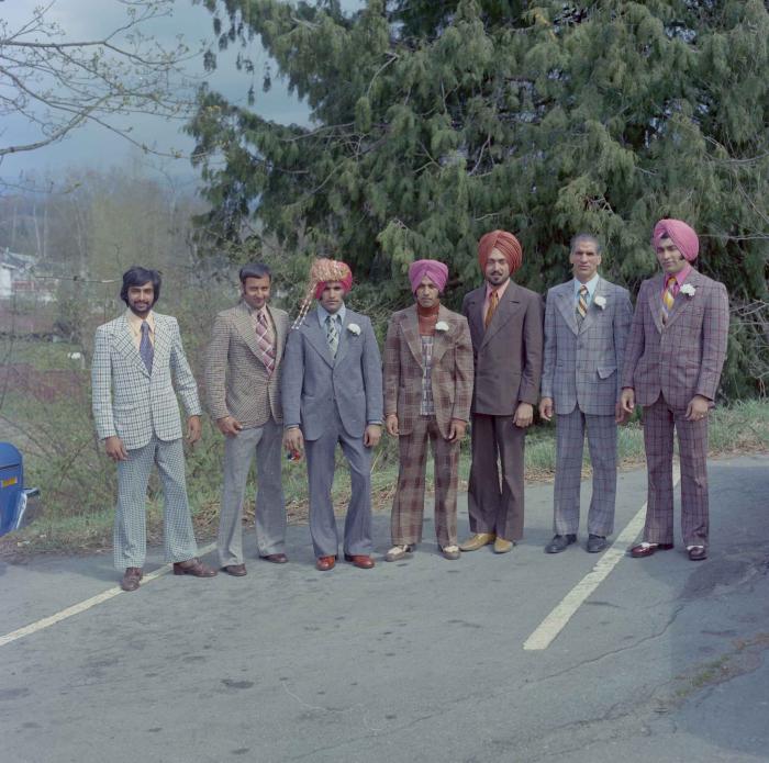 [Photo of S. S. Gill with unidentified men]