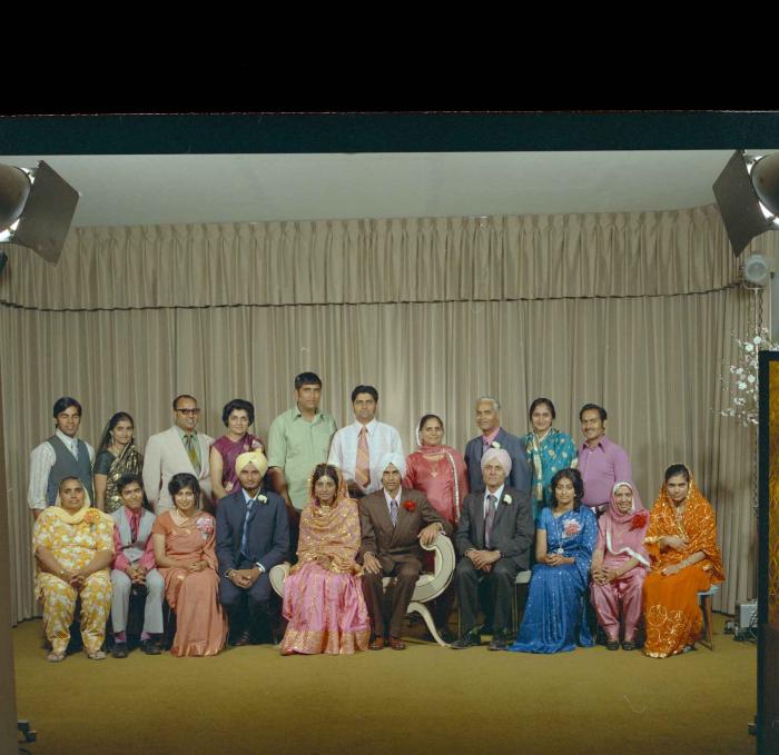 [Group photo of the newly wed couple, Rajinder Thind and Nash Gill with their family]