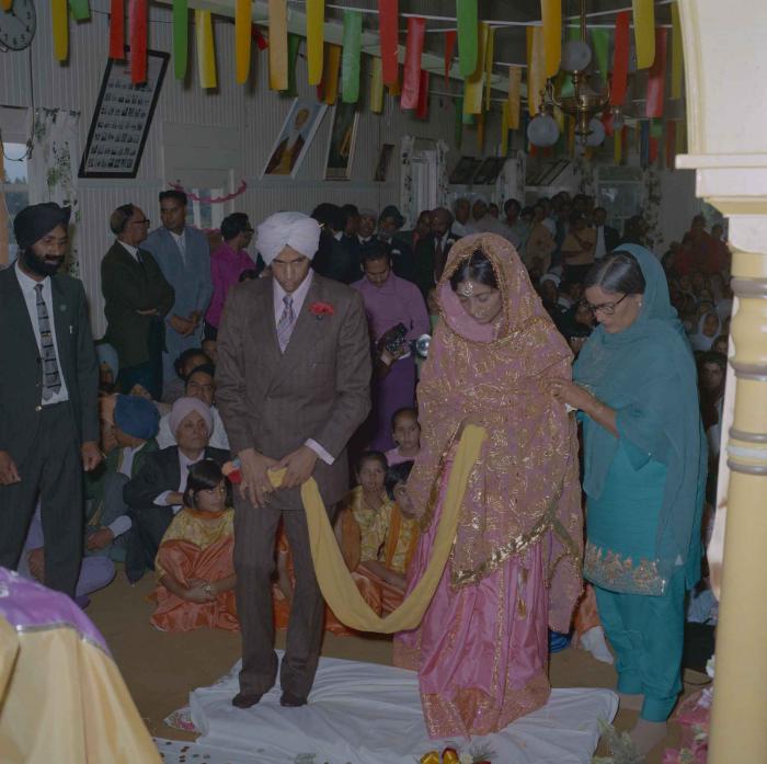 [Photo of Nash Gill and Rajinder Thind standing together]