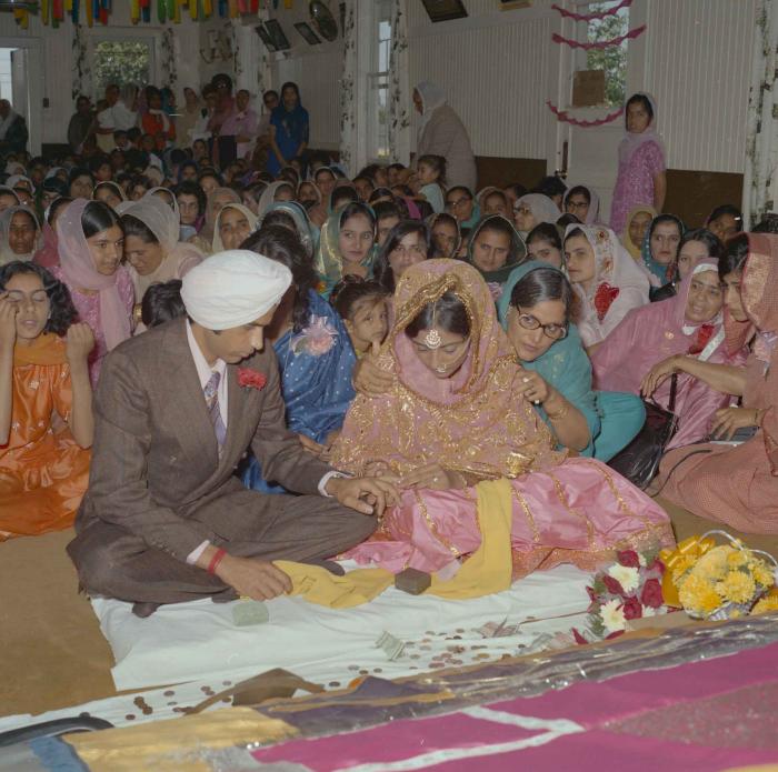 [Photo of Nash Gill and Rajinder Thind getting married]