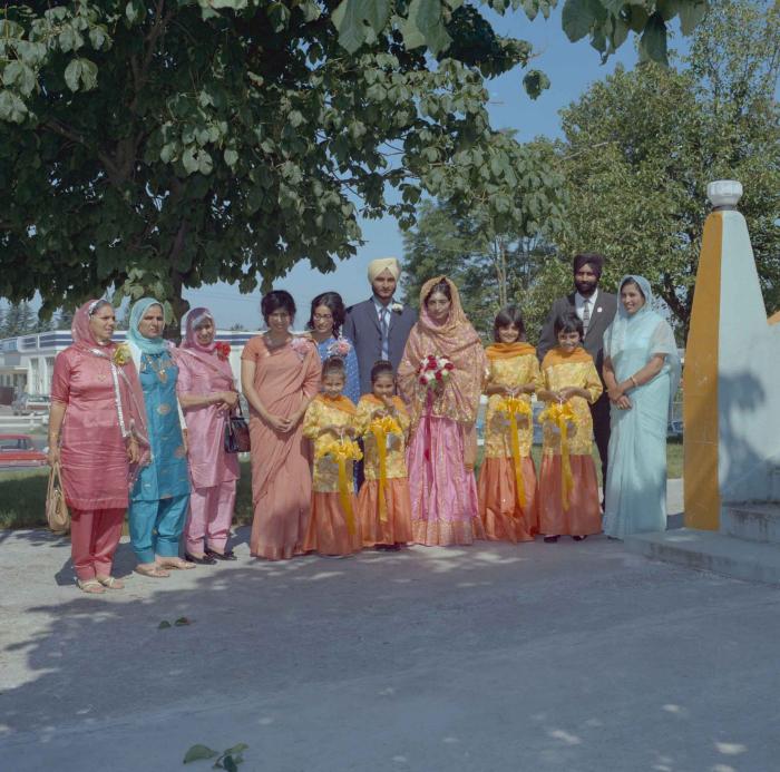 [Group photo of Rajinder Thind with family members]