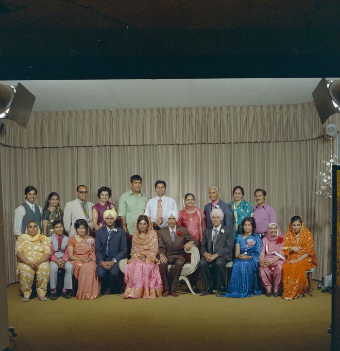 [Group photo of the newly wed couple, Rajinder Thind and Nash Gill with their family]