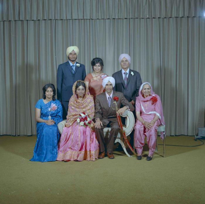 [Group photo of the newly wed couple, Rajinder Thind and Nash Gill with their family]