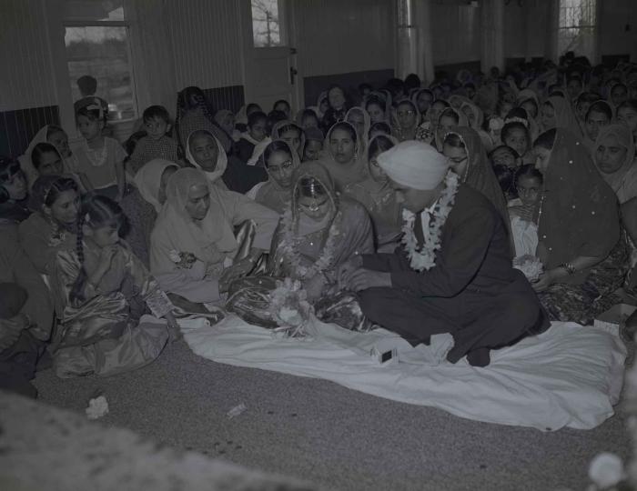 [Group photo of the Gill couple with family members]