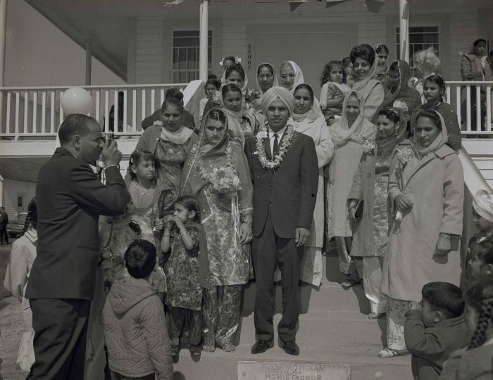 [Group photo of the Gill couple with family members]