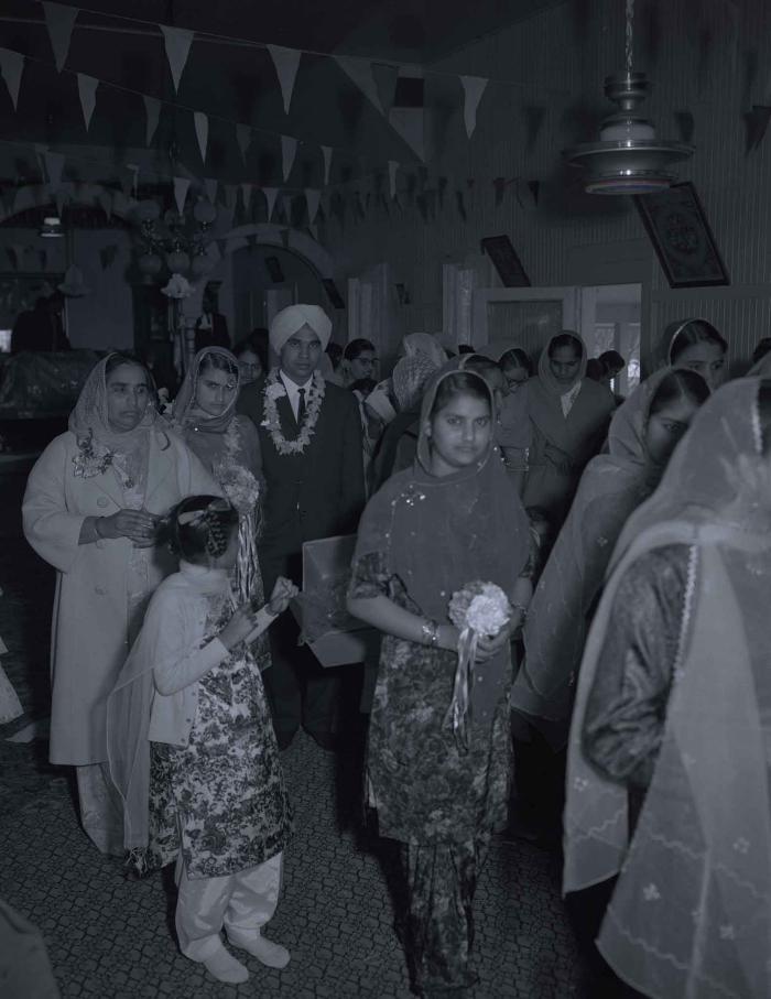[Group photo of the Gill couple with family members]