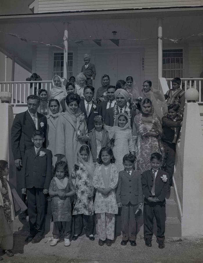 [Group photo of the Gill couple with family members]