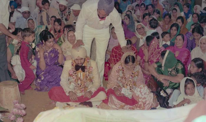 [Photo of Harbans Singh and Rupinder Toor]