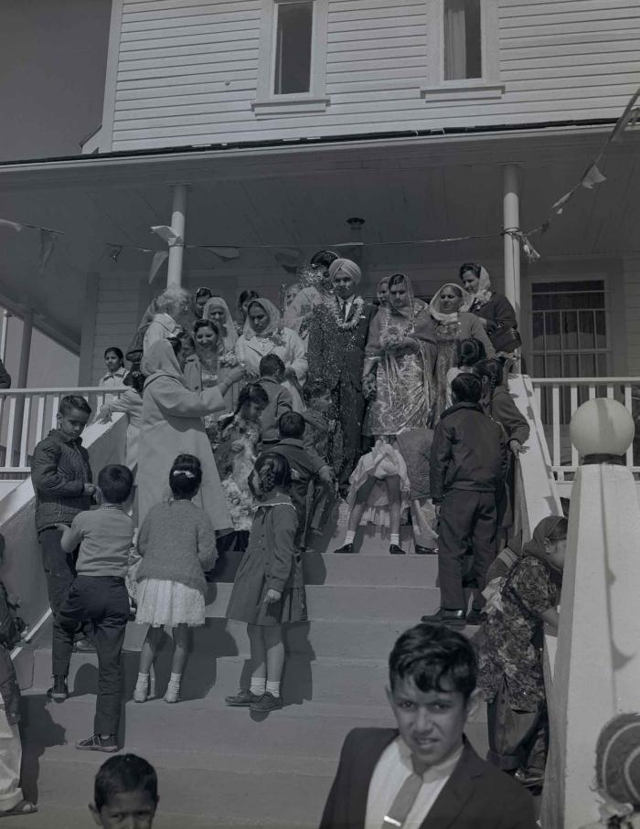 [Group photo of the Gill couple with family members]