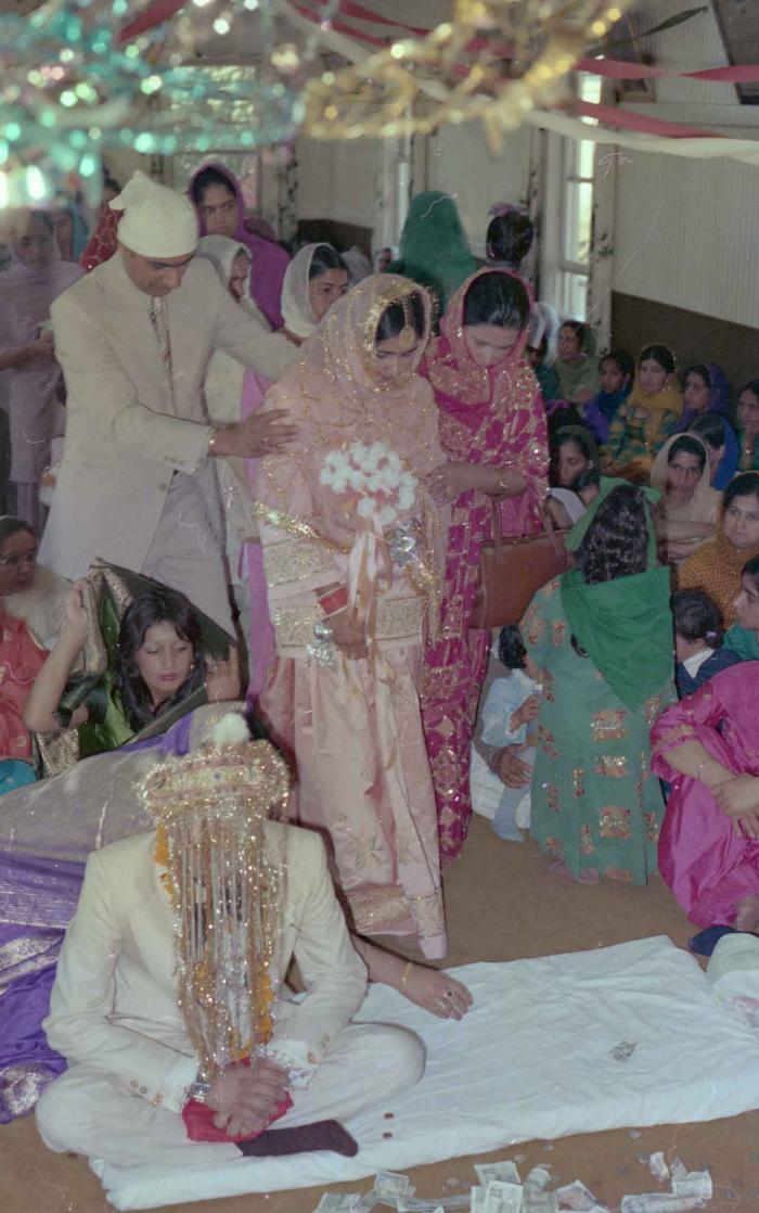 [Photo of Harbans Singh and Rupinder Toor]