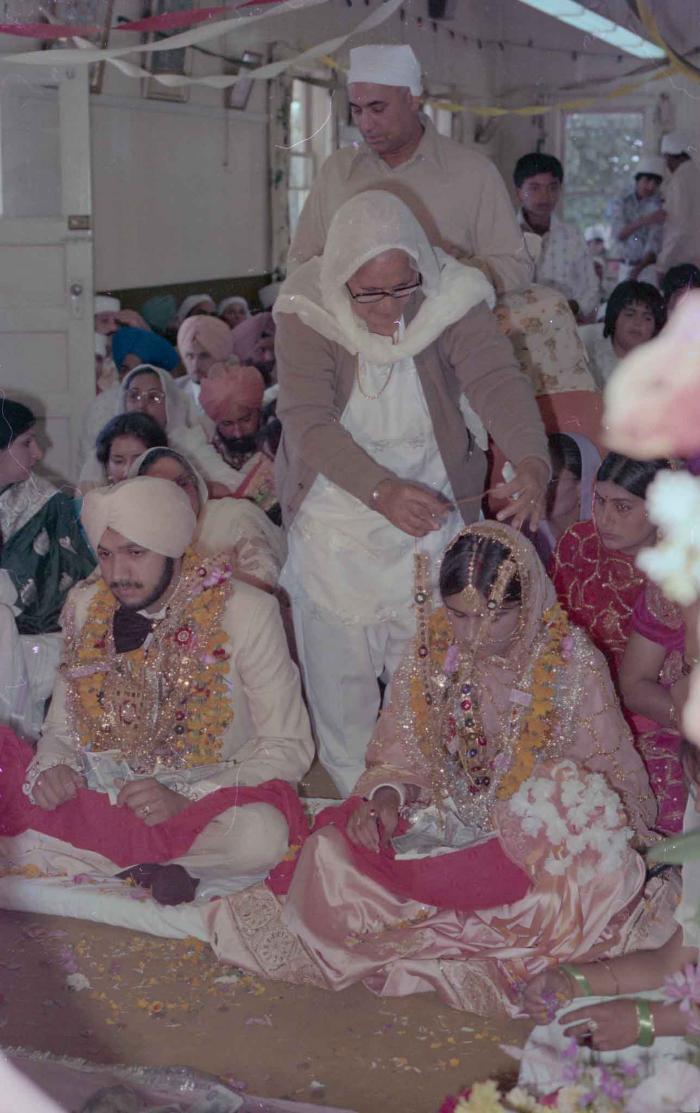 [Photo of Harbans Singh and Rupinder Toor]