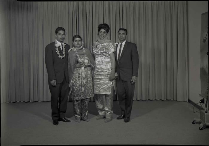 [Group photo of the Gill couple with family members]