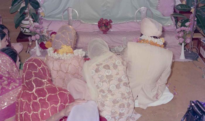[Photo of Rupinder Toor and Harbans Singh Grewal sitting in front of Sri Guru Granth Sahib]