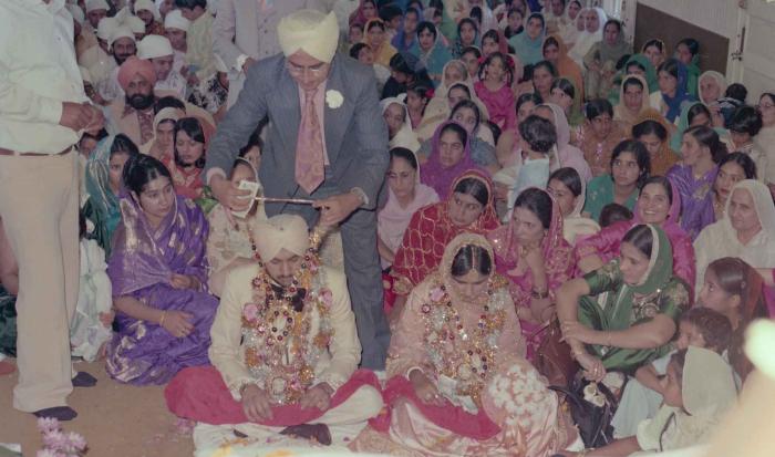 [Photo of Harbans Singh and Rupinder Toor]