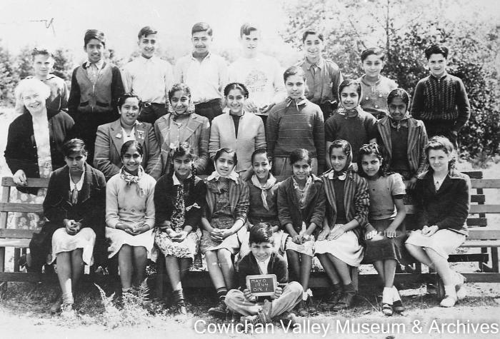 [Group of unidentified school children and teacher at Mayo School posing for class portrait]