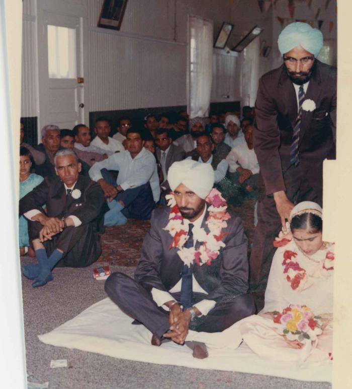 [Photo of Gurmail Singh Sidhu with his wife]