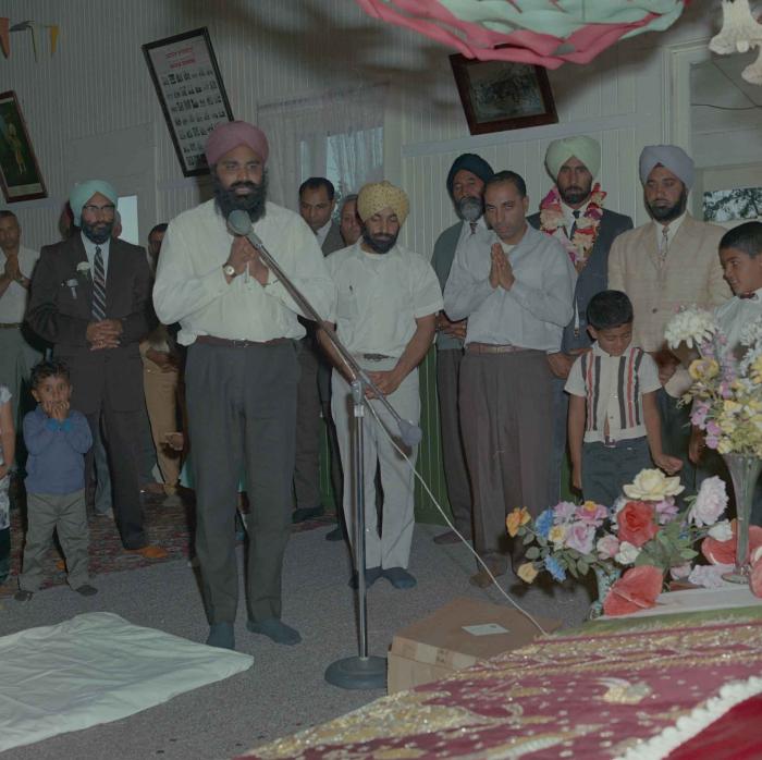 [Group photo of Gurmail Singh Sidhu with unidentified men]