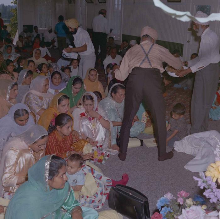 [Photo of Gurmail Singh Sidhu's wife with family members]