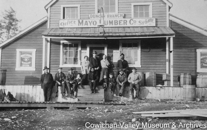 [The Duncan branch of the Mayo Lumber Co. office and store with an unidentified group of people]