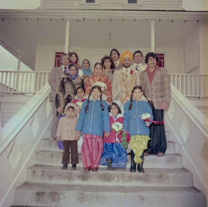 [Photo of Pushpinder Maan and Gurpreet Virk with family members]