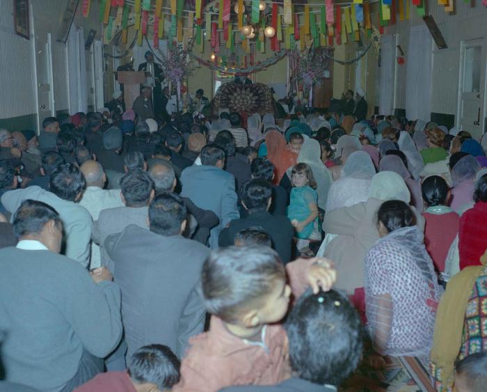 [Photo of Sri Guru Granth Sahib in the Gurdwara]