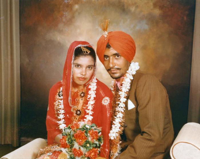 [Photo of Harcharn Singh and Karen Gurmail]
