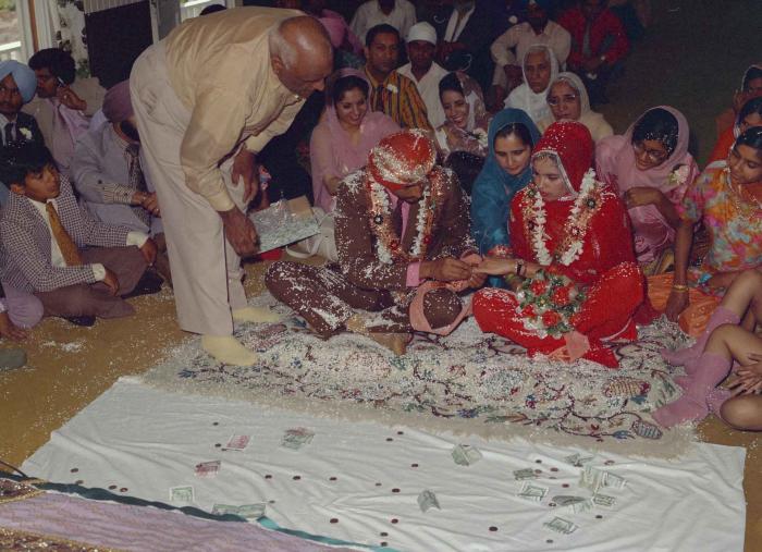 [Photo of Harcharn Singh and Karen Gurmail]