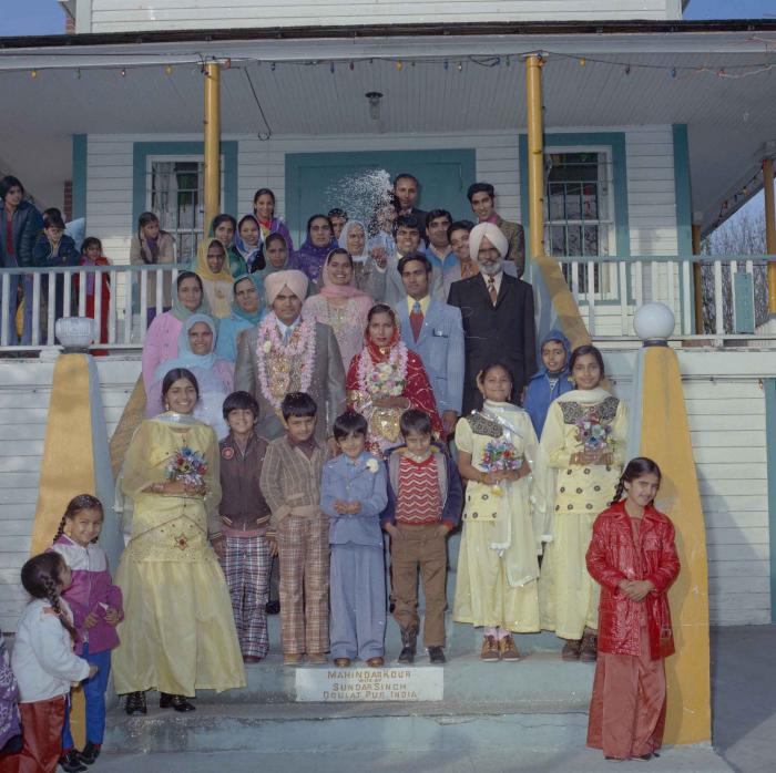 [Photo of Jagiar Singh Kingra along with an unidentified bride and wedding guests]