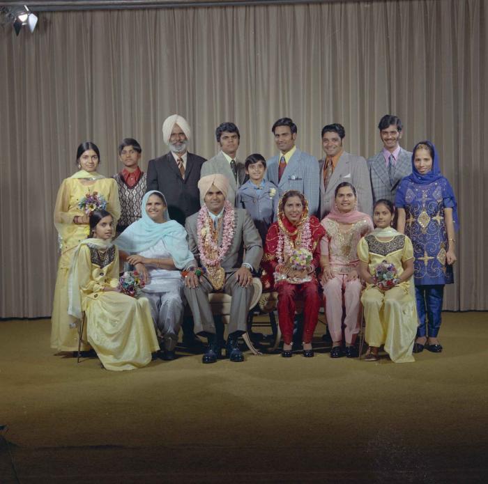 [Photo of Jagiar Singh Kingra along with an unidentified bride and wedding guests]
