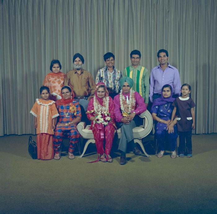 [Photo of Jaginder Singh Gill and Amarjit Gill with wedding guests]