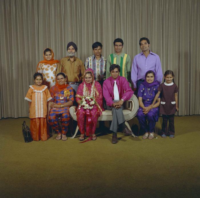 [Photo of Jaginder Singh Gill and Amarjit Gill with wedding guests]
