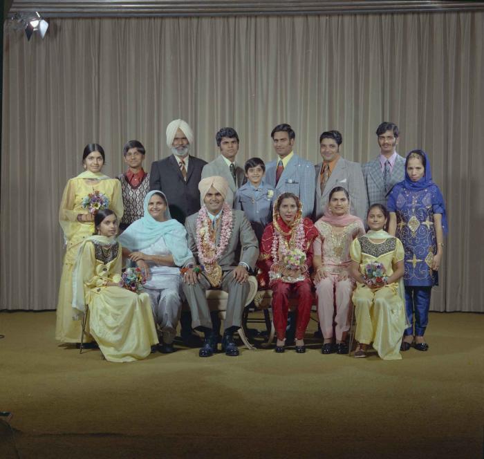[Photo of Jagiar Singh Kingra along with an unidentified bride and wedding guests]